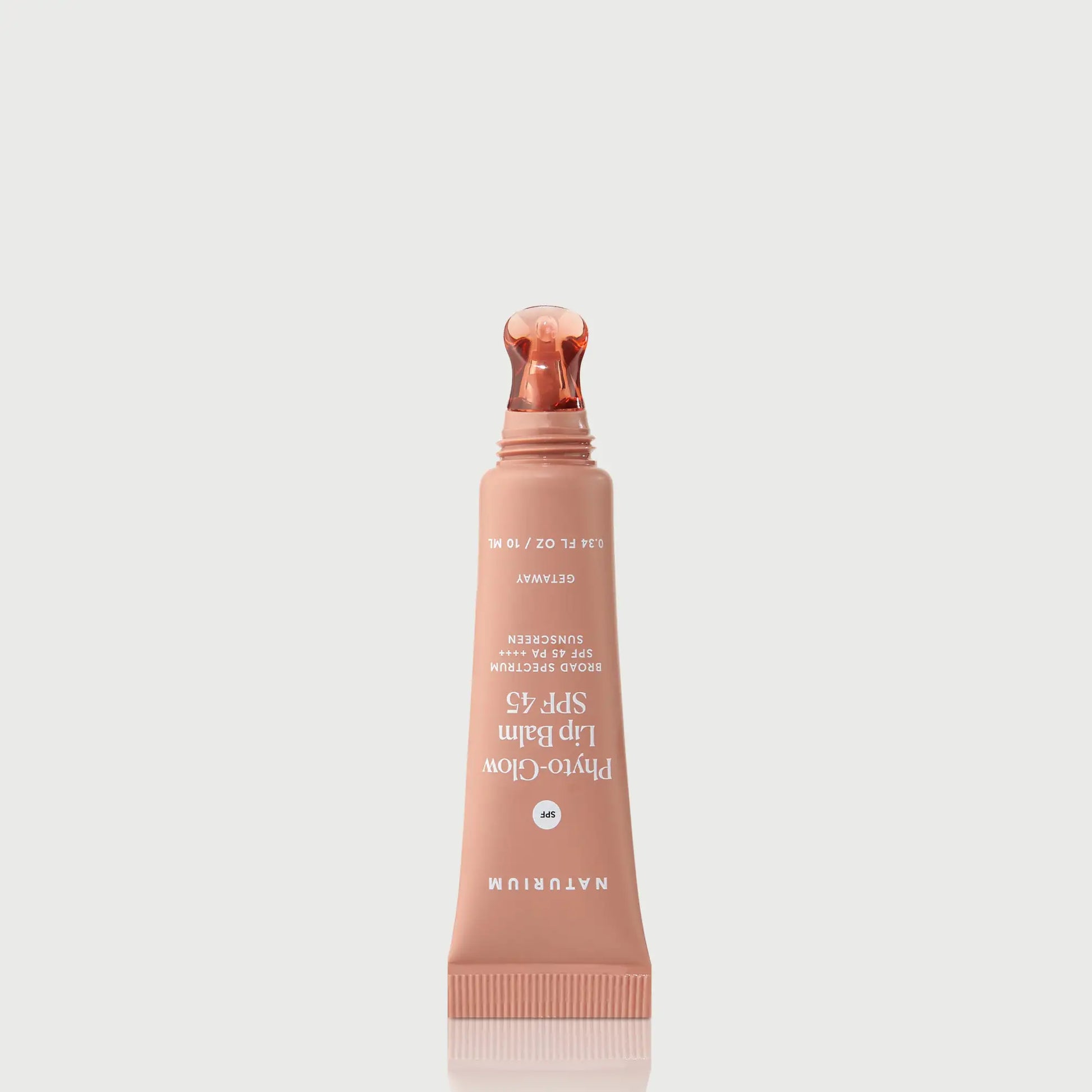 phyto-glow-lip-balm-spf-45-getaway-w7 NATR-10126_PhytoGlow_SPF_Getaway_primary_nocap_bonebkgd_1.webp